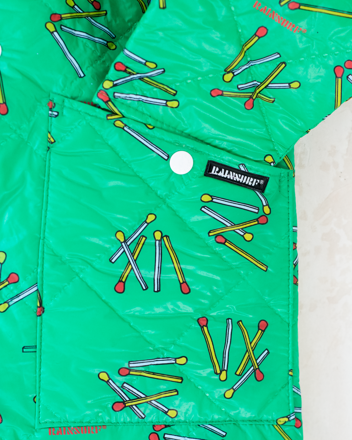 Green raincoat with matches | 6-7 years 