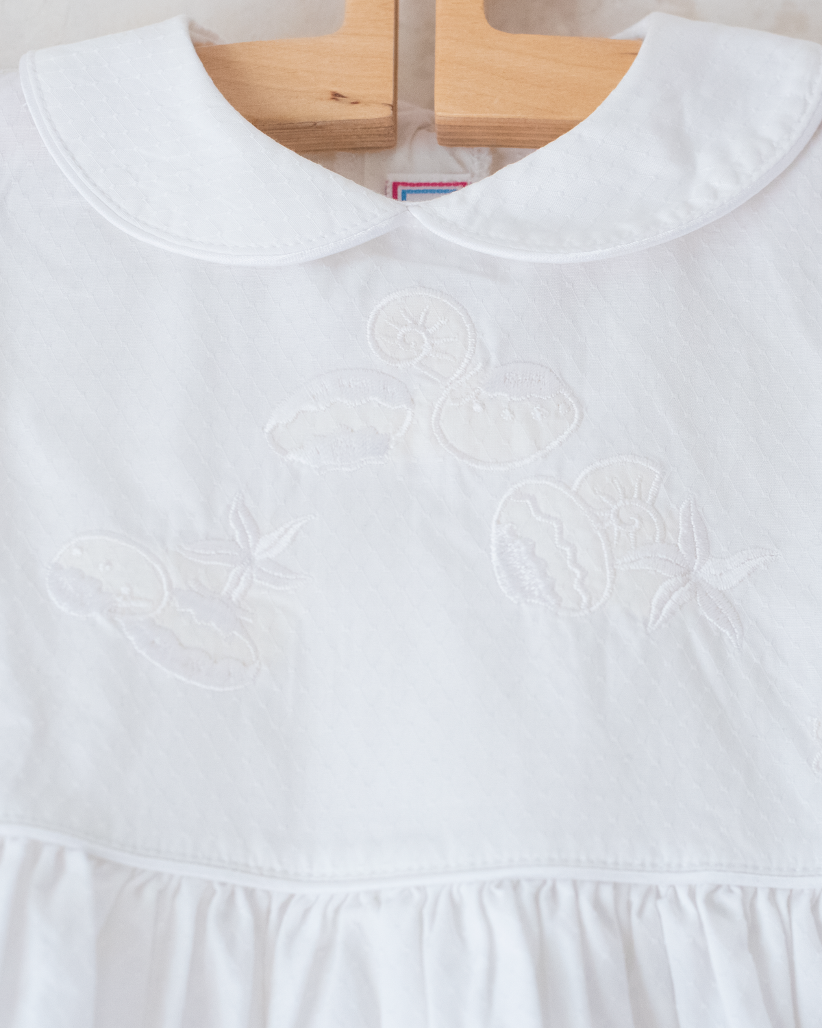 Yves Saint Laurent white dress with embroidered scallops | 12-18 months