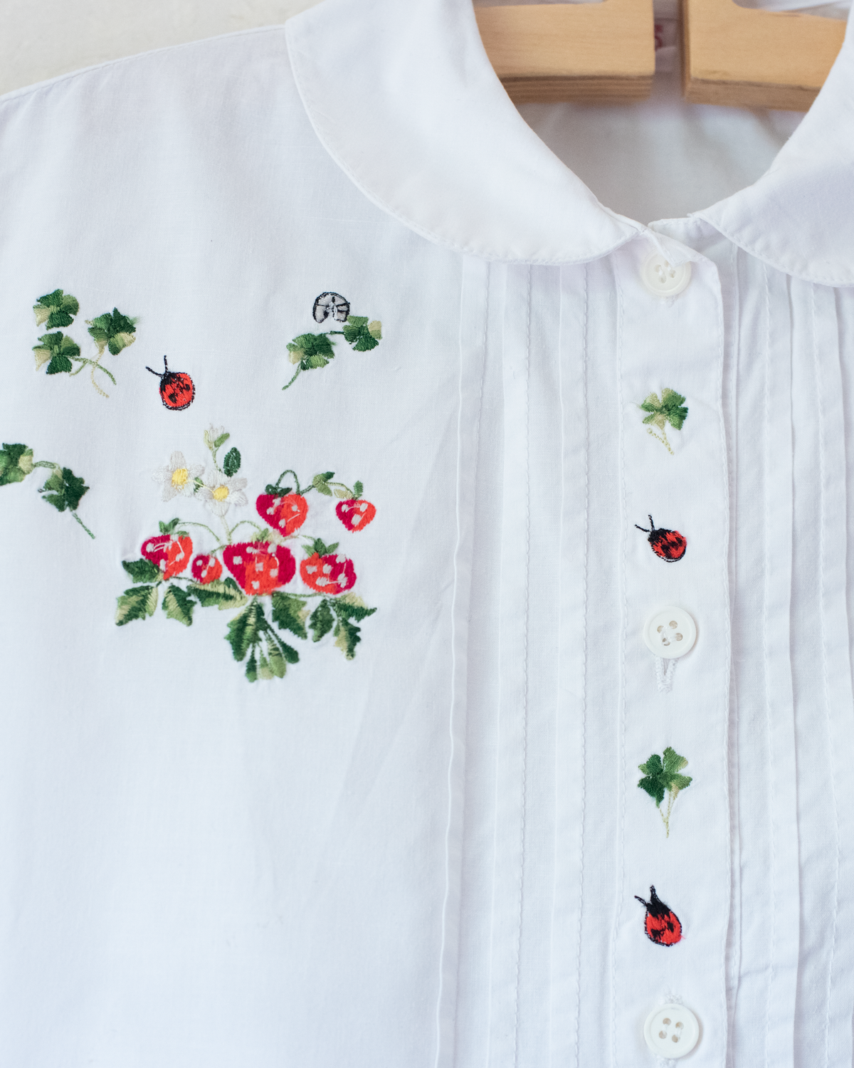 White shirt with strawberry and beetle embroidery | 6-7 years