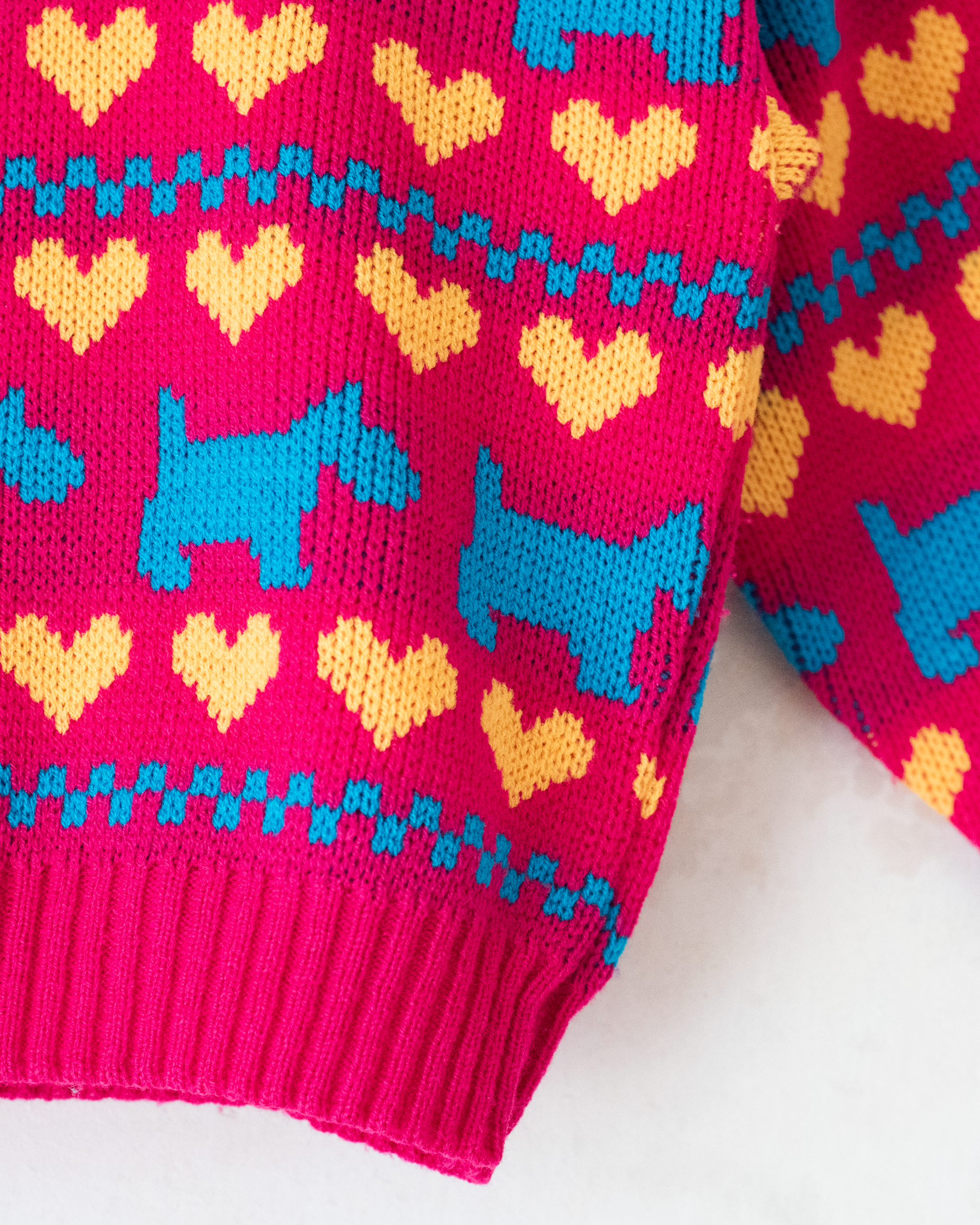 סריג ורוד עם שנאוצרים ולבבות | 12-18 חודשים