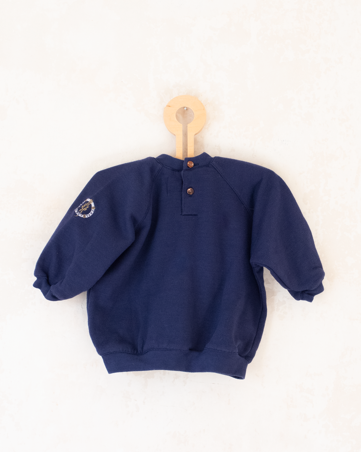 Blue sweatshirt with blue and gold embroidered anchor | 12-18 months