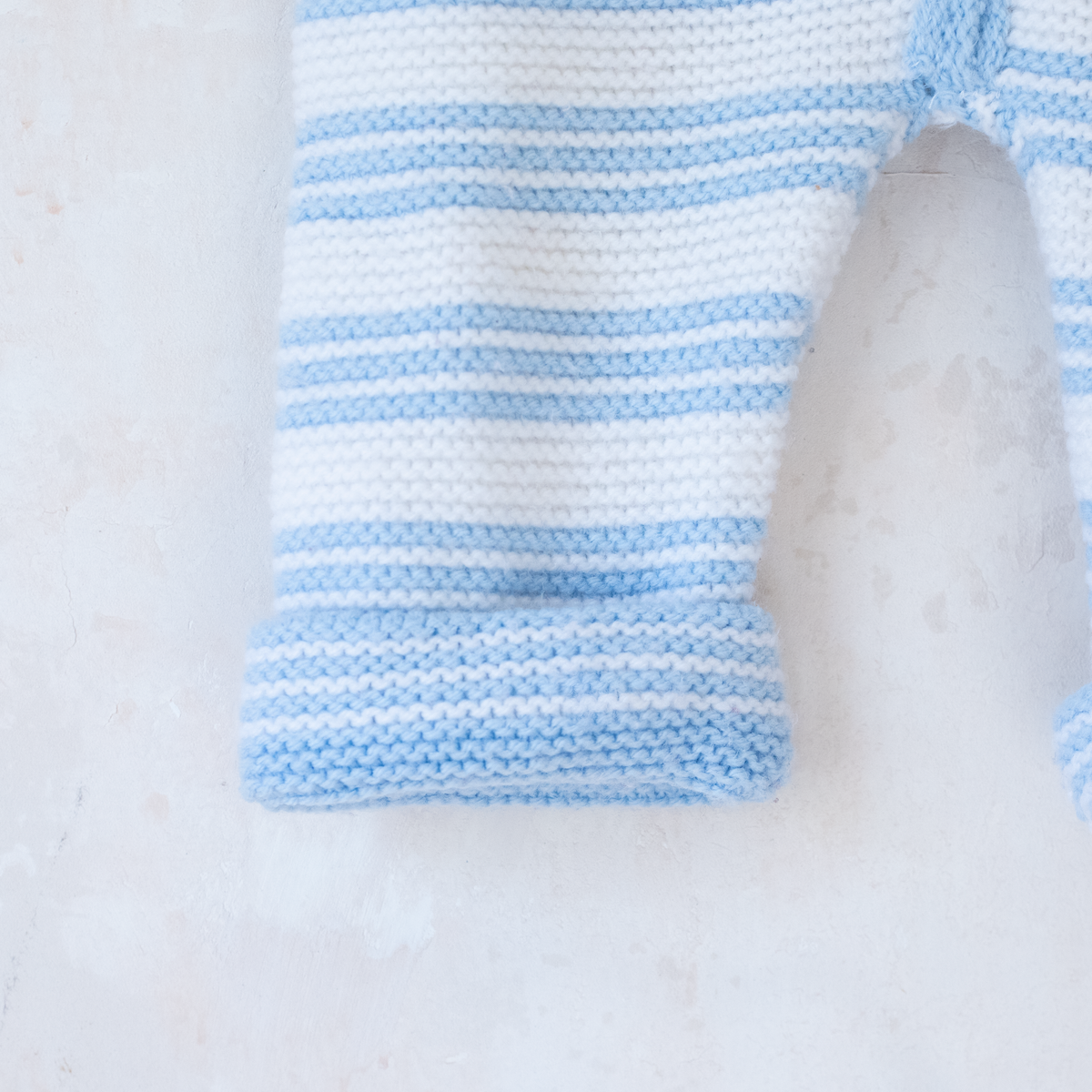 Knitted overalls in light blue and white | 6-9 months
