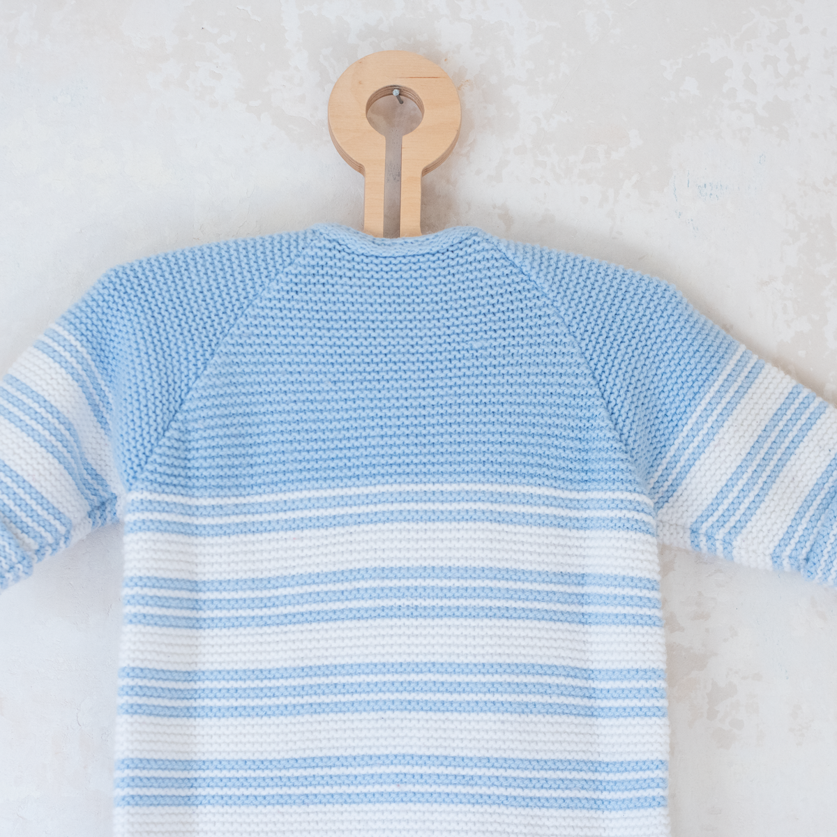 Knitted overalls in light blue and white | 6-9 months