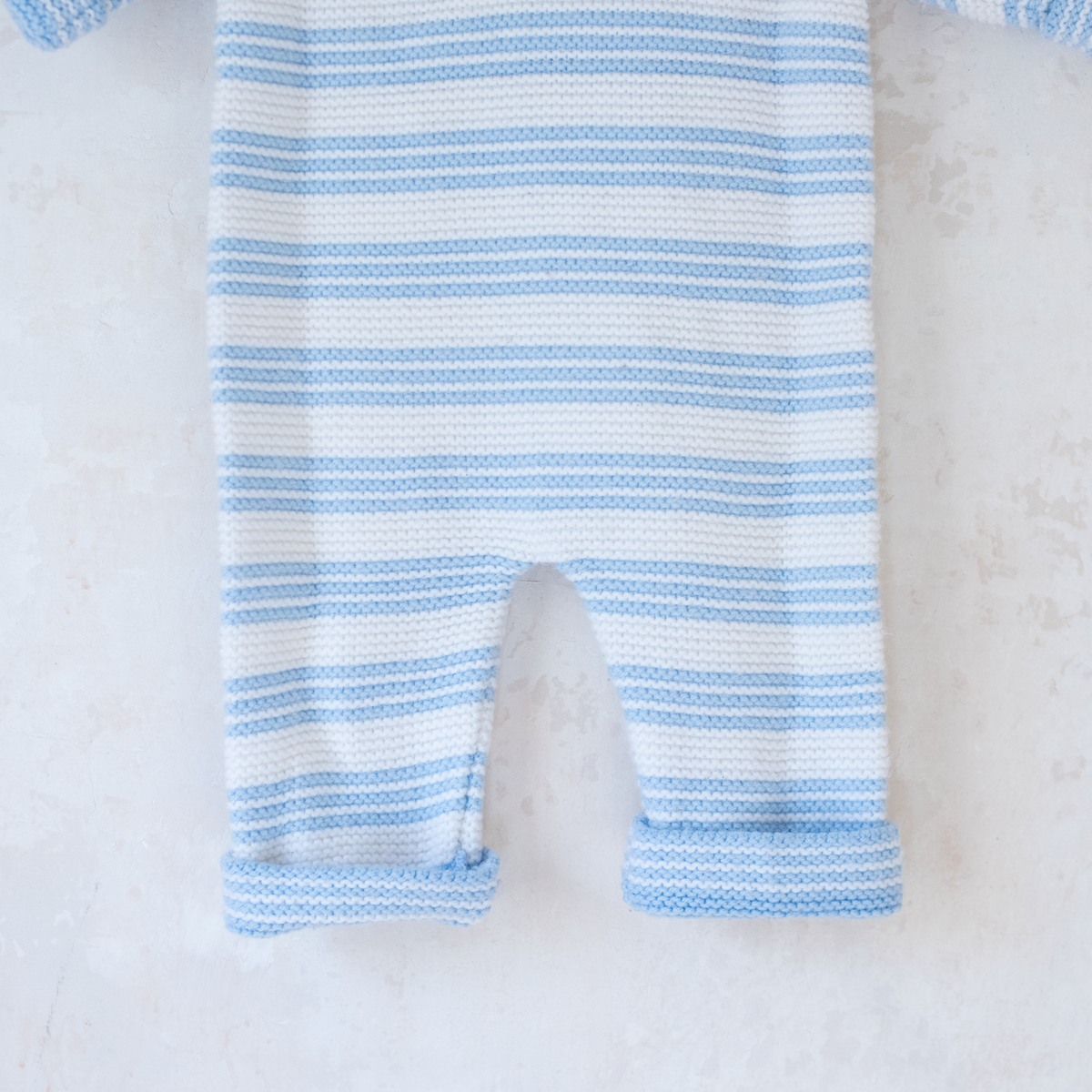 Knitted overalls in light blue and white | 6-9 months