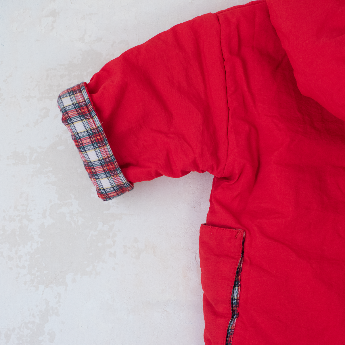 Red down jacket with checks from Yves Saint Laurent | 3-9 months